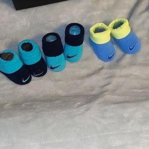 Three pairs of Nike booties